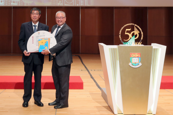 Book-giving session by Mr Zhao Jiankai, Deputy Commissioner of Ministry of Foreign Affairs of the People’s Republic of China in the HKSAR (left) to Professor Michael Hor, Dean of Law, the University of Hong Kong.